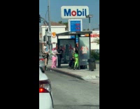 Women in spiky outfits poses waiting shed