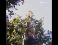 Guy blue pajama pants dances house roof 