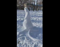 Rat shaped snowman sculpture at park 