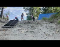 Dog jumps sand hill lands on face 