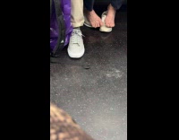 Woman on subway has feet out of shoes 