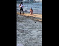 Girl white bikini kneel beach ice cream