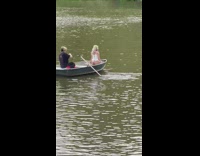 Guy photographs woman wearing lingerie in boat 