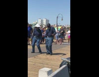 Beach pier performance older couple dance tropical