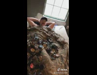 Guy pours empty dip tins onto friend 