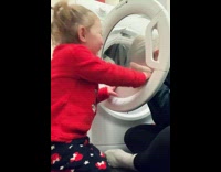 Toddler hits mom with washing machine door