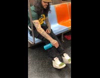 Man sprays water to shoes with grass