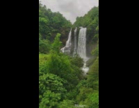 Train ride pass by waterfalls slow motion