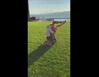 Two guys hold each other cartwheel fail 