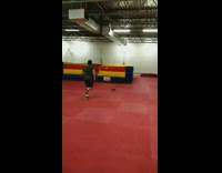 Kid jumps on bouncy castle wall and flips over