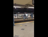 Guy jumps over train tracks 