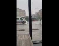 Kid laugh at shirtless man dance in rain