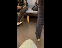 Abandoned bottle of lotion under subway seat