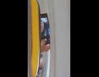 Woman blonde selfie airplane window corner