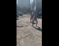 Woman pink skirt crouch tiger claws pose