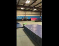 Guy red shorts misses trapeze front flip falls on blue floor