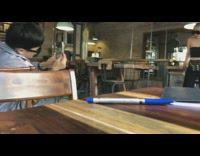 Woman bowl cut large black glasses