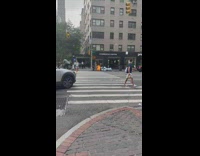 Garbage bags burn on street outside Starbucks