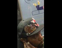 man with turkey and santa on black hat