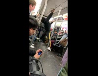 Collab Subway Creatures - Man contorts and bends his arms and joint around then dances on subway train 