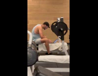 Man use laptop on gym bench press