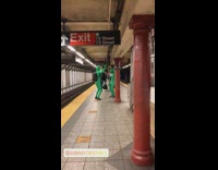 Two guys green bodysuit costume dance platform 