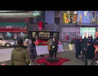 Two women dances while phone with a ring light rotates around them