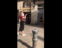 Woman in red stripes top dances at the street Part 1