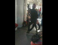 Backwards Hat Man Dances with Rag Doll Dummy in Subway