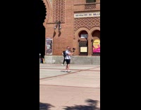 Man spins around with a digital camera at the park