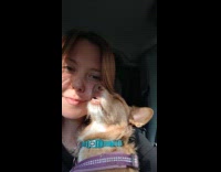 Dog asleep beside face of the woman