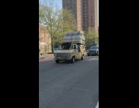 Van Carries Bunch of Mattress on Top 