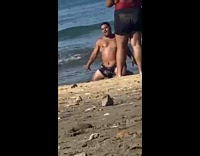 Big guy kneel dance drop cap beach
