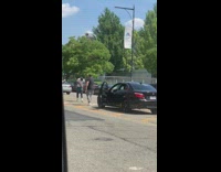 Man black shirt rap black car music video