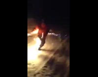 Idiot steps on flaming gas can