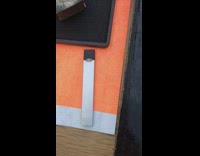 Woman white dress complains about hostess smoking juul vape pen while on the job at front door