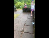 Woman black bra whip her ponytail garden