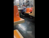 Man plays the piano inside subway train