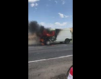 Guy throws jug of water into car on fire