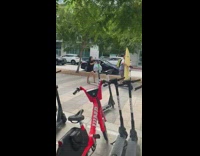 Collab Kook Of The Day - Guy rides electric bird scooter with yellow surfboard 