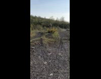 Guy rides bicycle hits second dirt hill 
