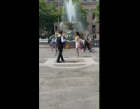 Woman in white dress stopped to tiktok dance