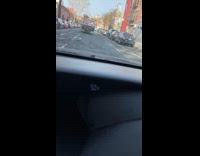 Truck carrying pallets of cargo on the road and one pallet falls off 