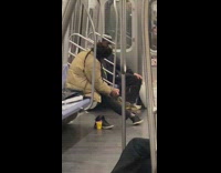 Man scrubs his foot on the subway 