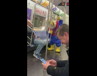 person in chicken costume red white blue