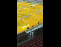 Two girls dance color yellow football field