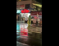 White shirt girl green inflatable dinosaur costume 