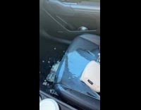Woman spills coffee inside car 