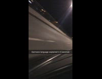 Guy sticks small German flag outside car window while driving, flag flies away and guy curses in German