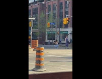 Girl ripped jeans dance street stoplight barricade